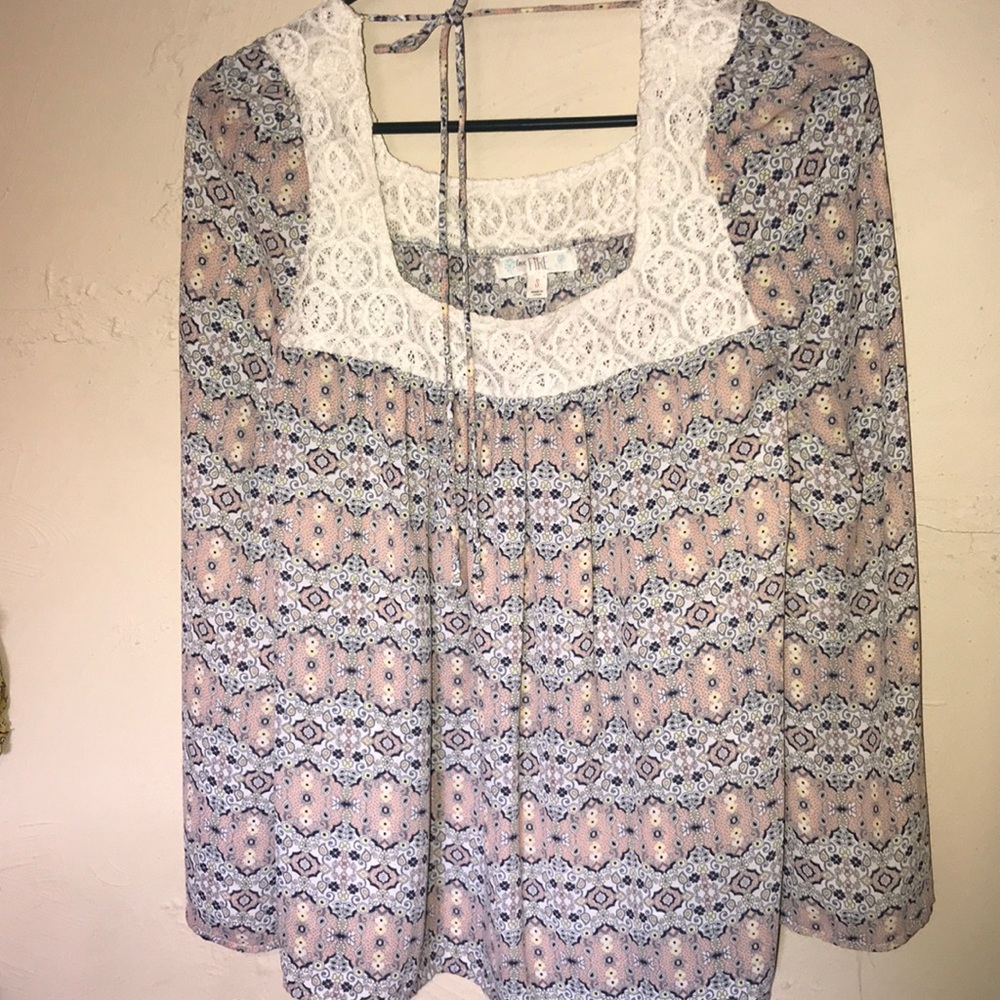 Worn once. Size small. Ties in the back